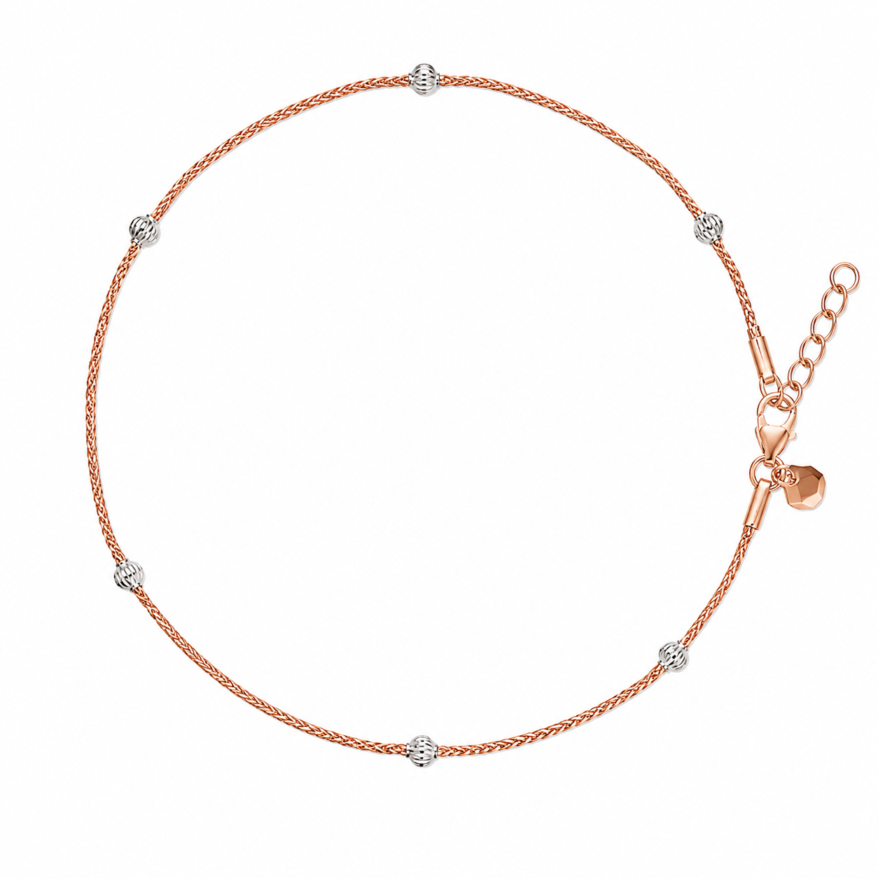 Rose gold anklet with small silver beads on a white background