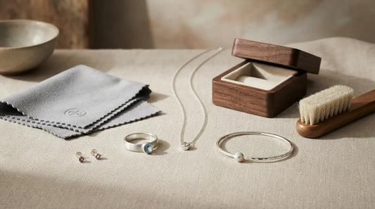 Custom jewellery care and maintenance guide featuring silver jewellery, gemstones, polishing cloth and jewellery storage box
