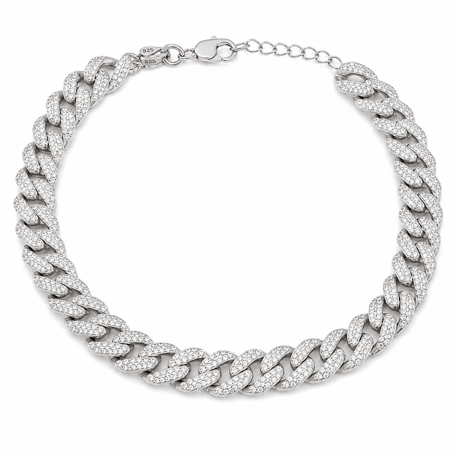 A bold 925 sterling silver Cuban link pet necklace entirely set with clear miniature round stones, shown against a plain light gray surface.