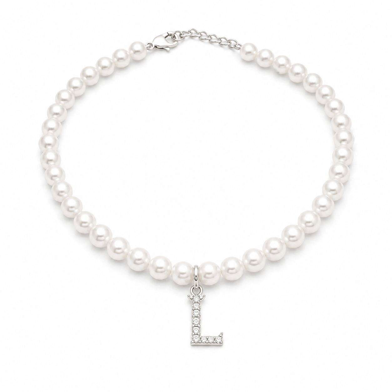 A strand of uniform white pearls forming a pet necklace with a silver, stone-set letter 'L' monogram pendant in the center.