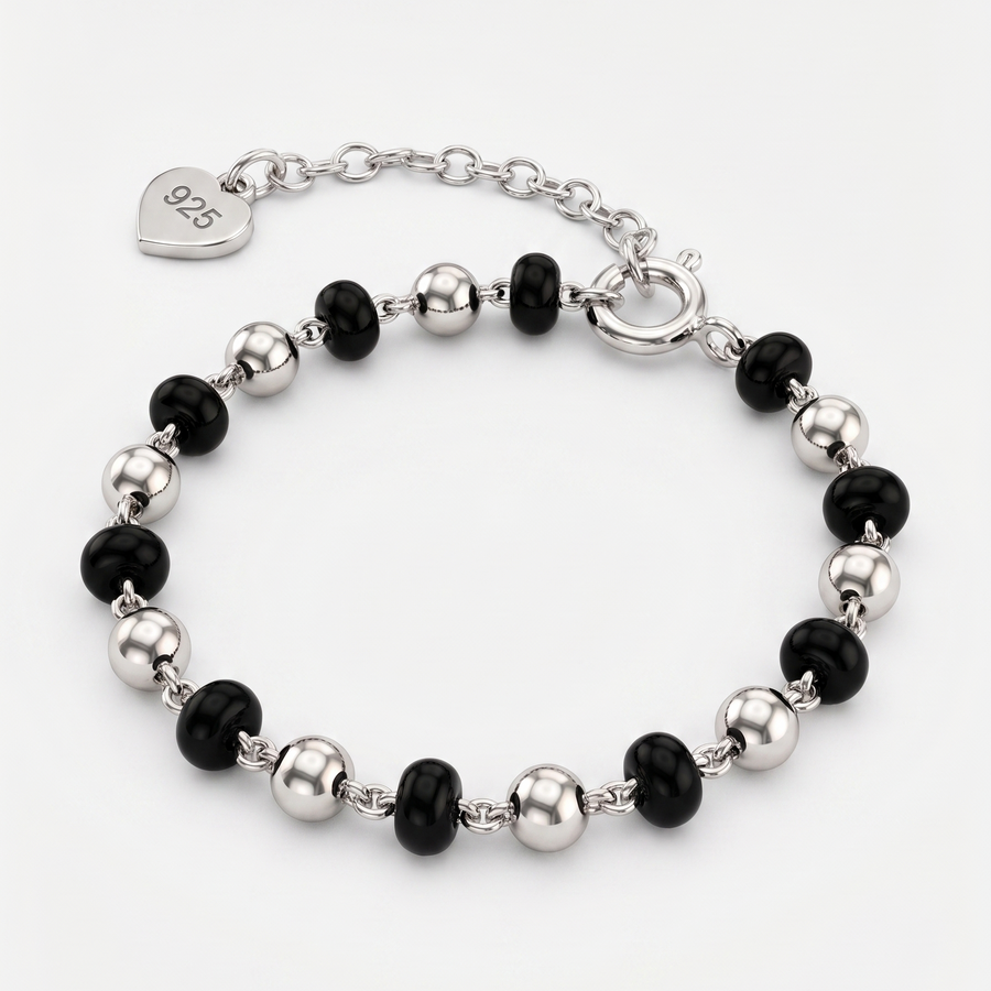 Bracelet with black and silver beads on a white background