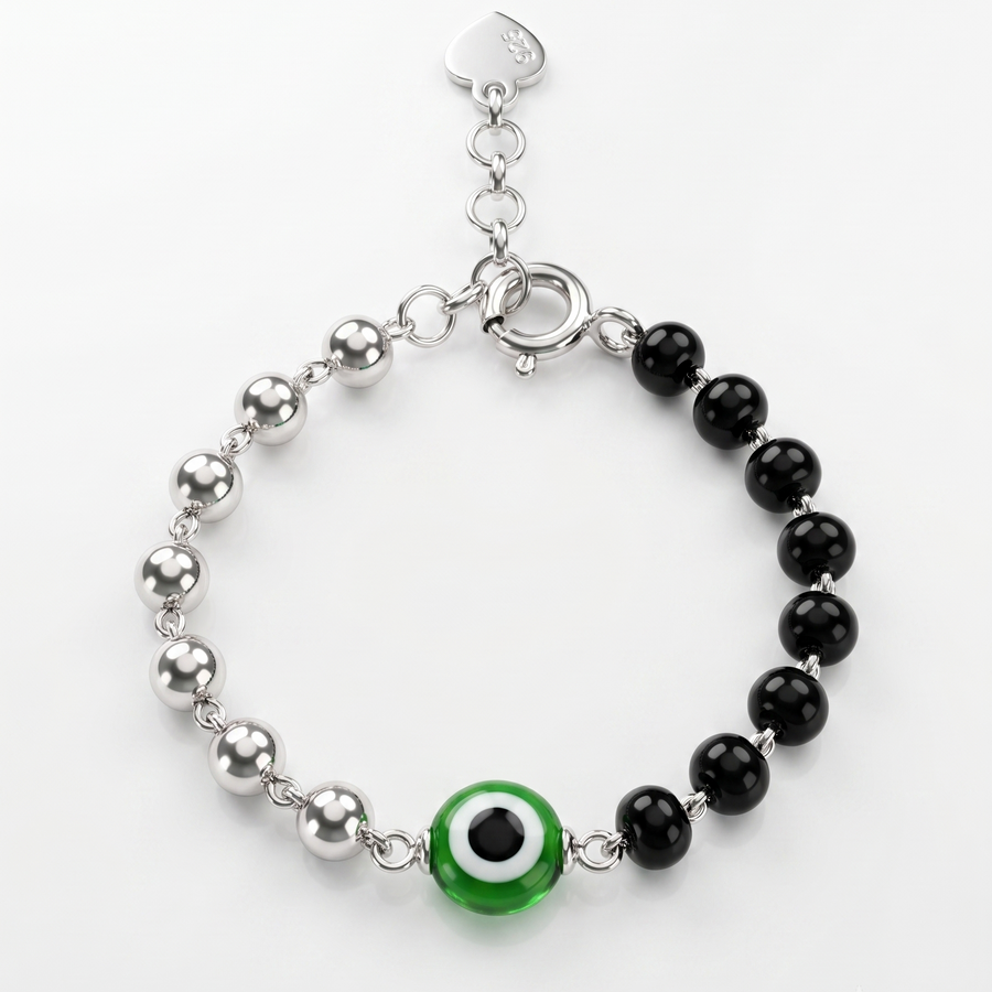 Bracelet with black beads and a green evil eye charm on a white background