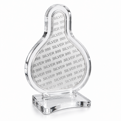 Clear crystal object with 'SILVER 999' text on a white background