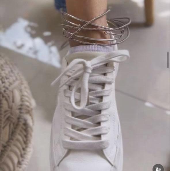 Custom Modern Silver Anklet designed by Rivansh using flexible, high-gloss mirror finish sterling silver memory wire layered beautifully over white lifestyle sneakers.
