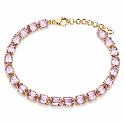 Gold Necklace with pink gemstones on a white background