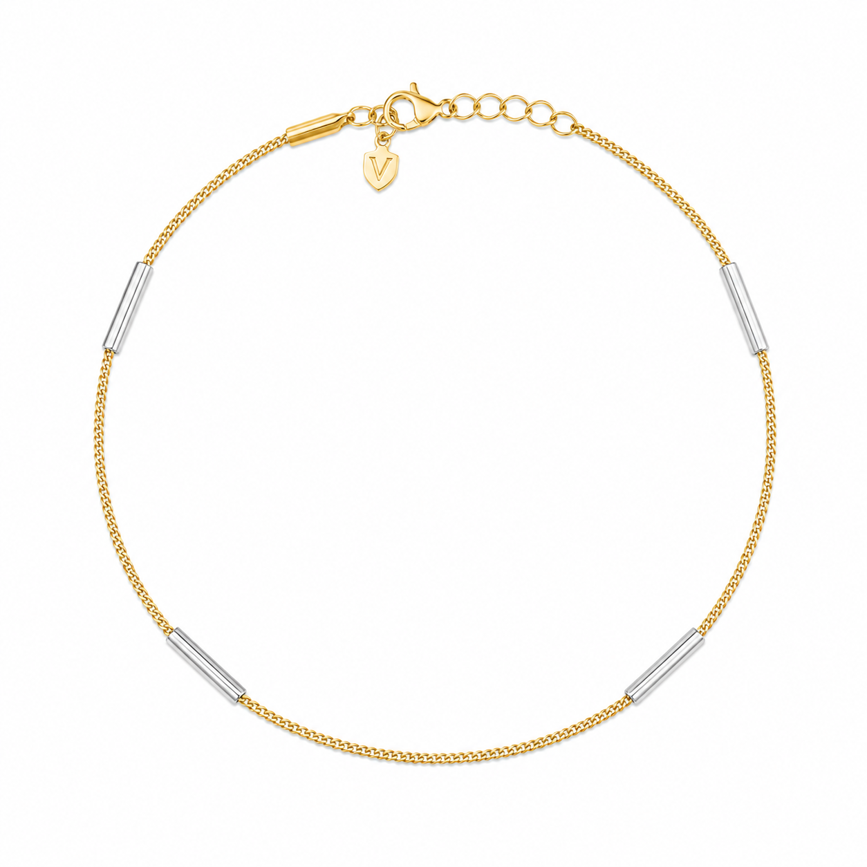 Gold bracelet with silver cylindrical beads on a white background