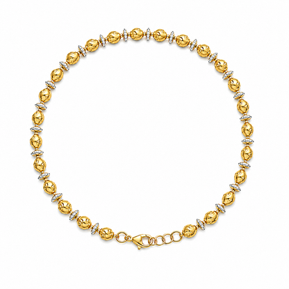 Gold plated anklet with diamond accents on a white background