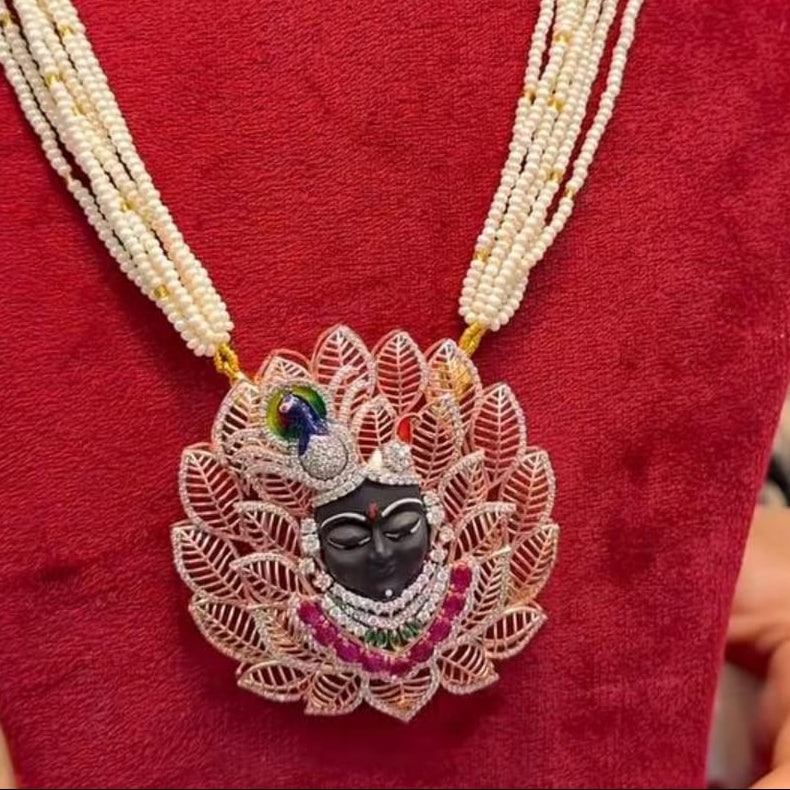 Krishna Heritage Pendant in premium platinum-look rhodium-plated sterling silver featuring a double row of square-cut deep sapphire-blue border stones surrounding fine artistic lace details by Rivansh.