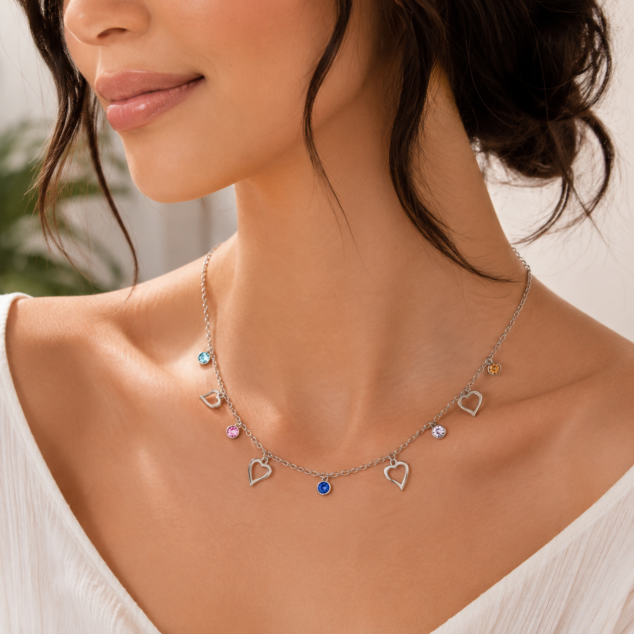 Necklace with heart-shaped charms worn by women