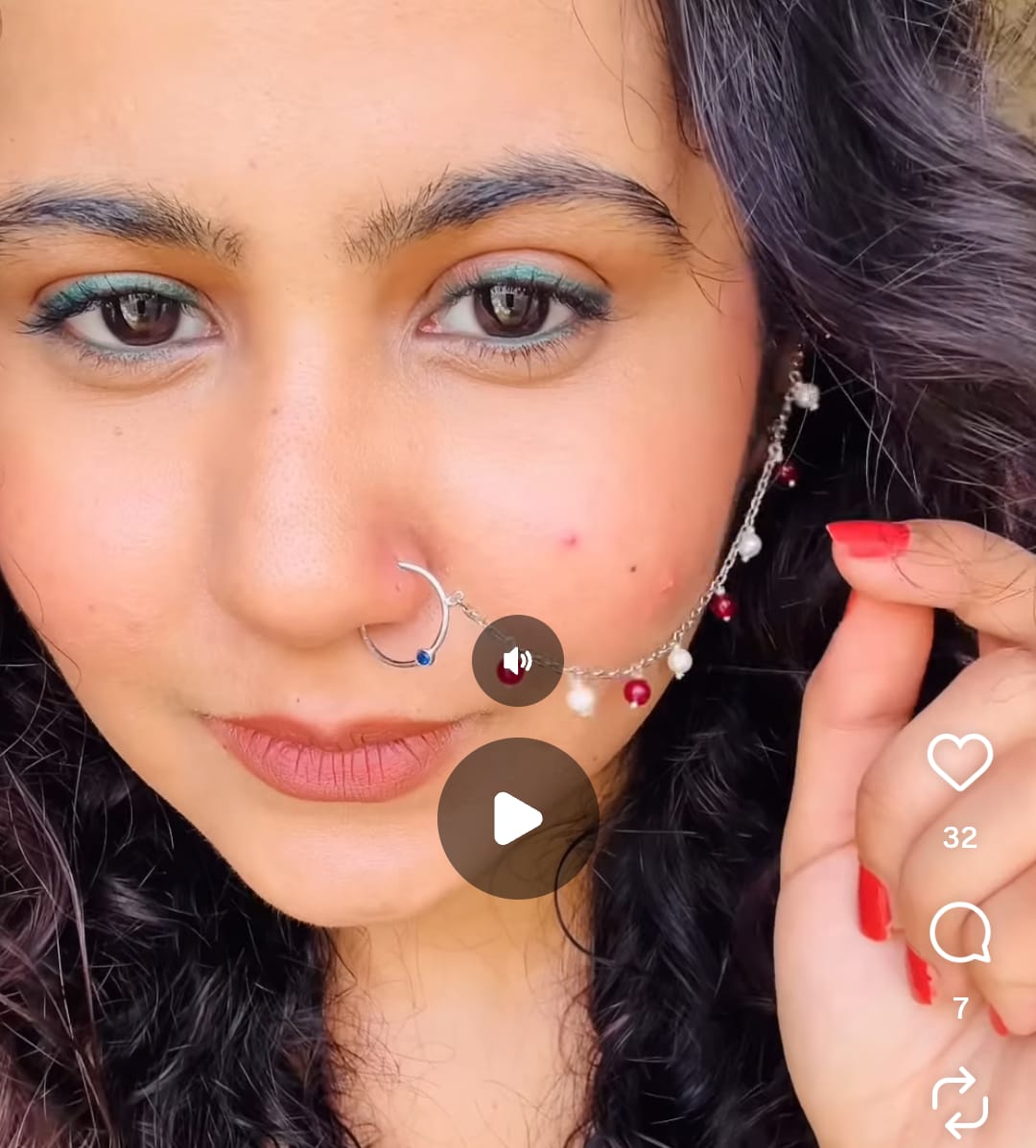 Nose Chain Jewellery in fine sterling silver worn as a lifestyle look, featuring an ultra-thin delicate link draped accent line dotted with alternate crimson and white pearl beads by Rivansh.