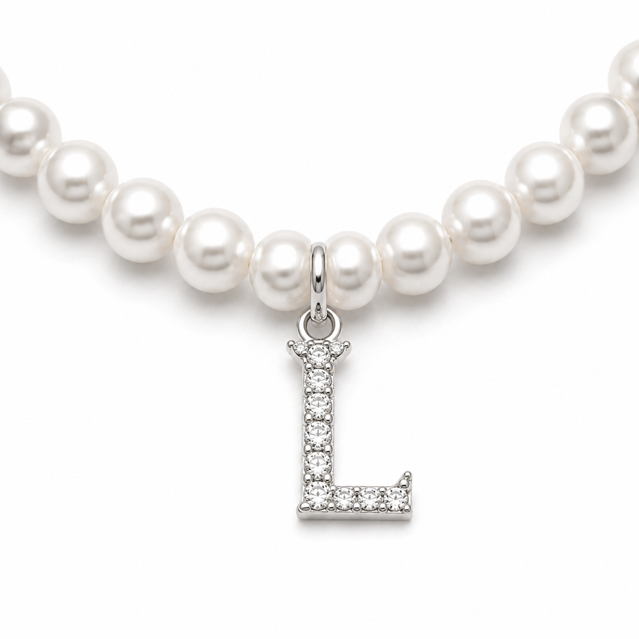 Pearl necklace with a silver 'L' charm on a white background