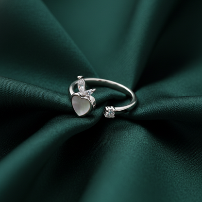 Rivansh Luxe Mirage ring in certified 925 silver featuring a prominent cushion-cut AAA Cubic Zirconia centerpiece enclosed in a micro-pave halo on silk cloth