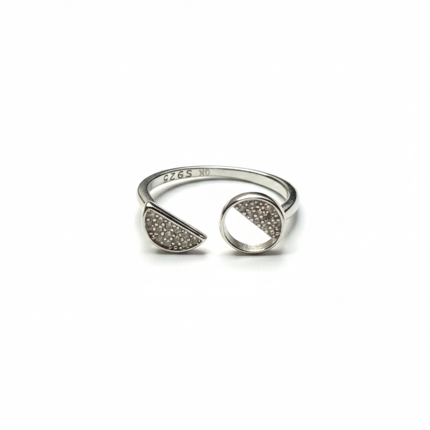 Rivansh asymmetric ring in 925 fine silver featuring a graduated multi-size stone row layout.