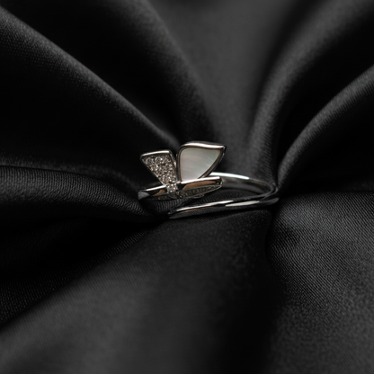 Rivansh horizontal east-west profile minimal solitaire ring in certified 925 fine silver on silk cloth