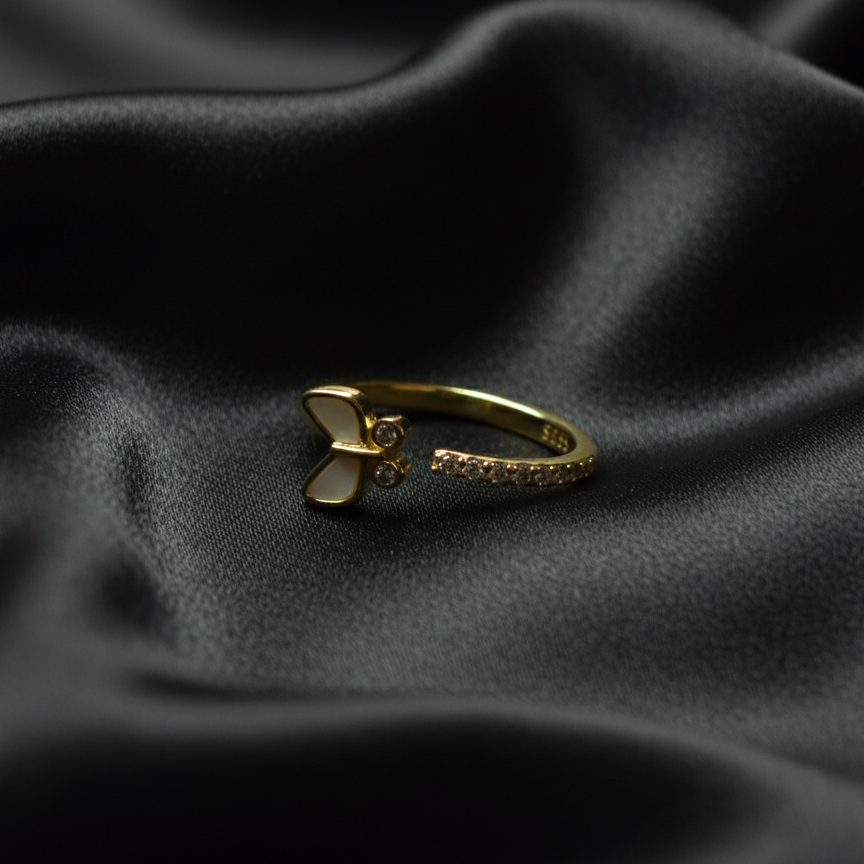 Rivansh open gap dynamic style adjustable ring in 925 silver with dual endpoint AAA Cubic Zirconia accents on silk cloth background