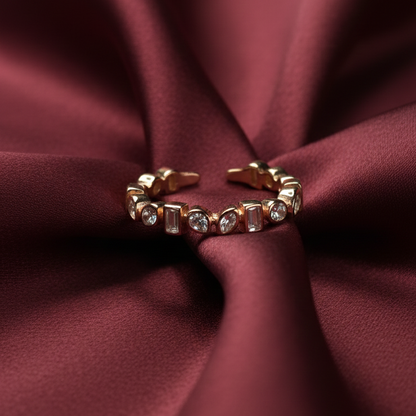Rivansh rose gold plated fine stacking band ring featuring a continuous line of micro-pave zircon accents on silk cloth background