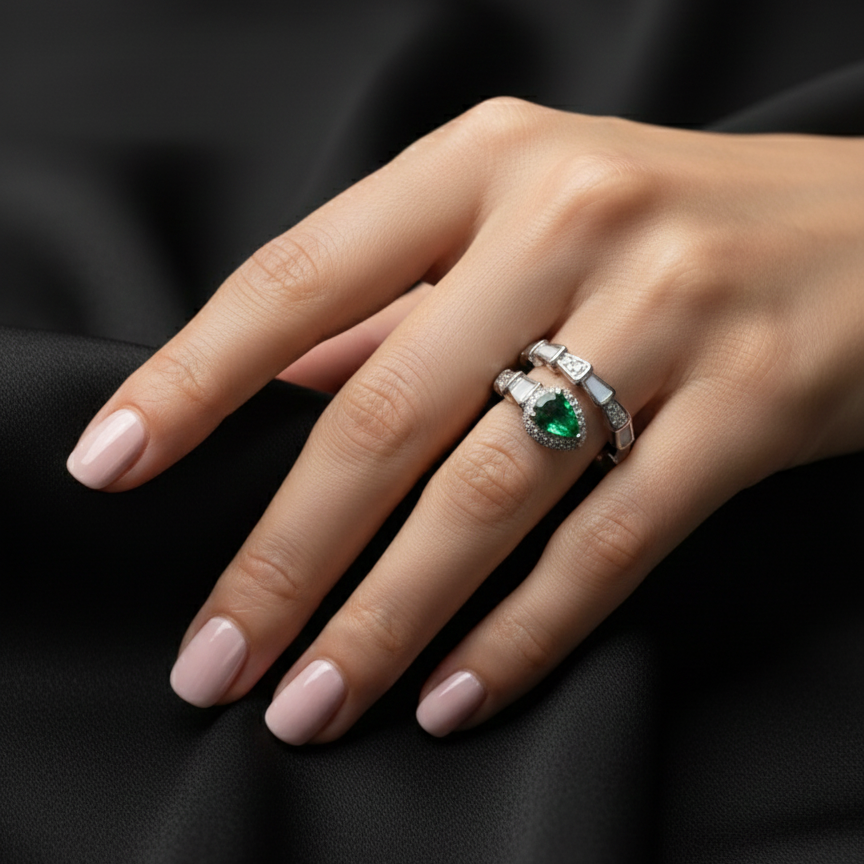 Rivansh water drop baguette solitaire ring in certified 925 silver with low-profile corner prongs on beautiful model hand