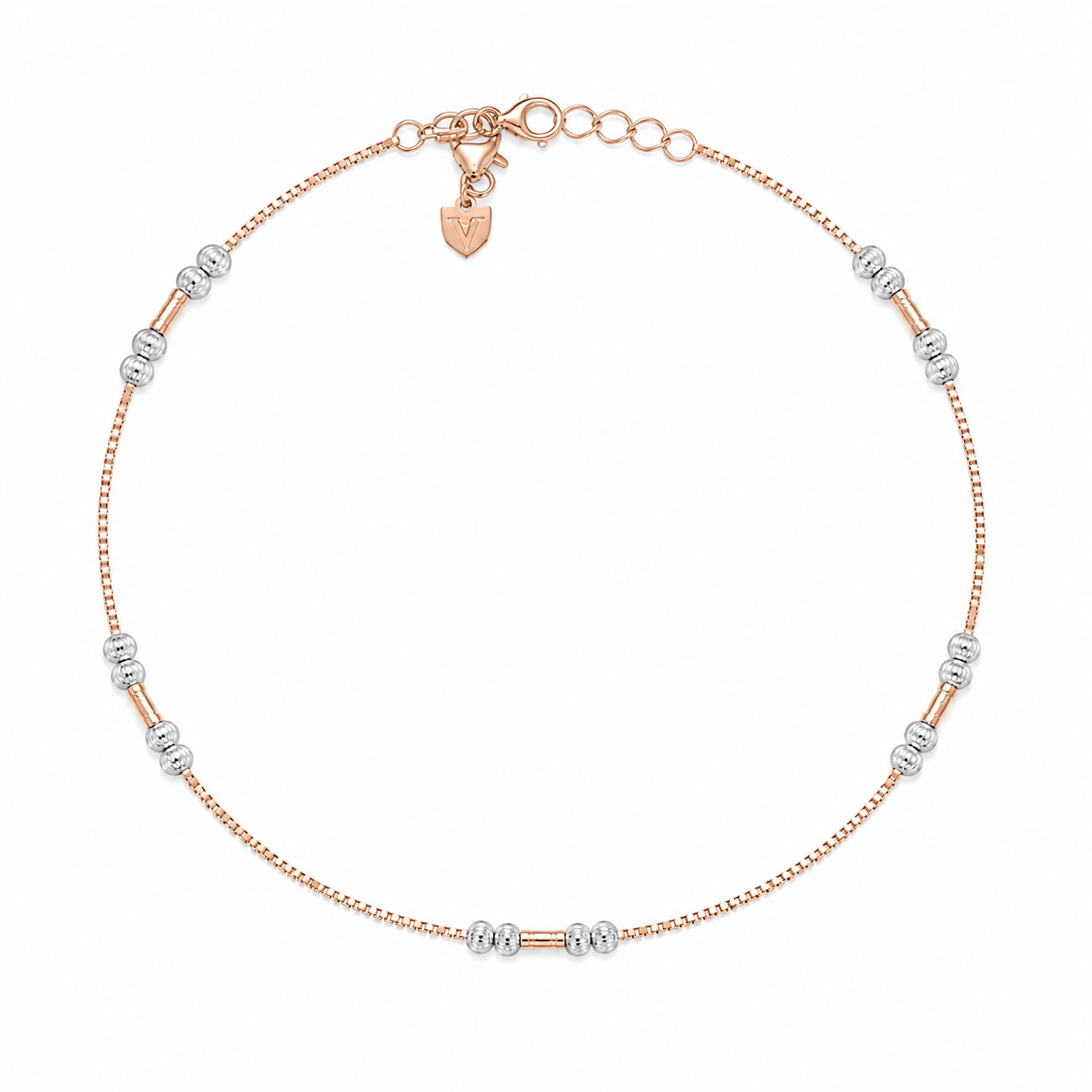 Rose gold and silver beaded anklet on a white background