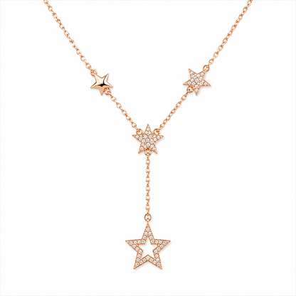Rose gold star-shaped necklace on a white background