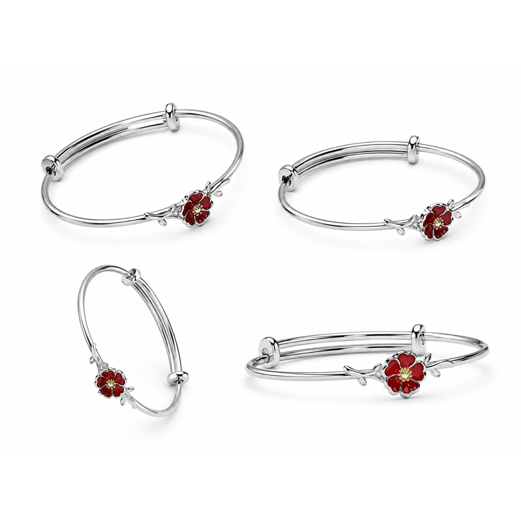 Set of silver bangles with red flower charms on a white background