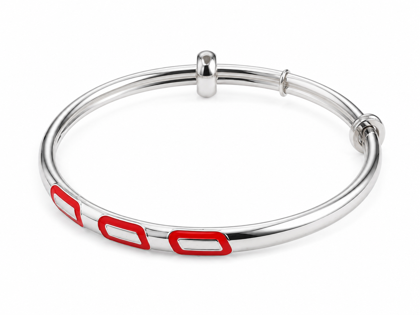 Silver bangle with red accents on a white background
