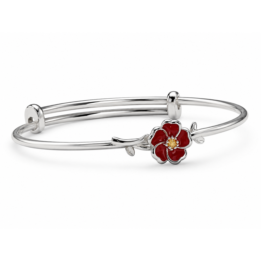 Silver bracelet with a red flower charm on a white background