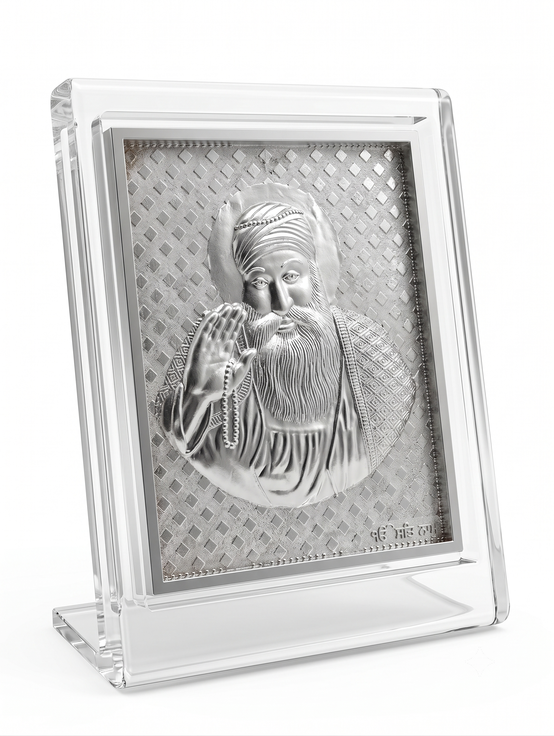 Silver religious icon in a clear acrylic frame on a white background