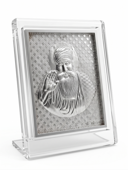 Silver religious icon in a clear acrylic frame on a white background