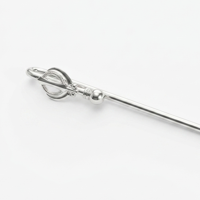 Silver spoon with decorative handle on a white background