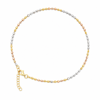 Three-tone gold anklet on a white background