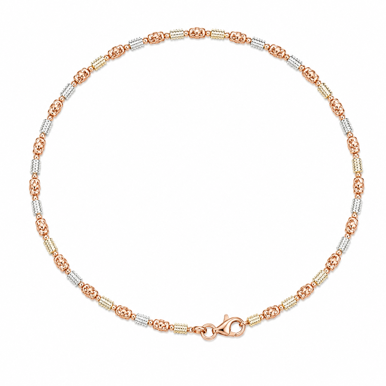 Two-tone gold anklet on a white background
