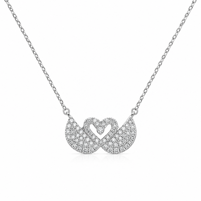 Two interlocking pavé-set swan charms connected to a polished 925 sterling silver link chain.